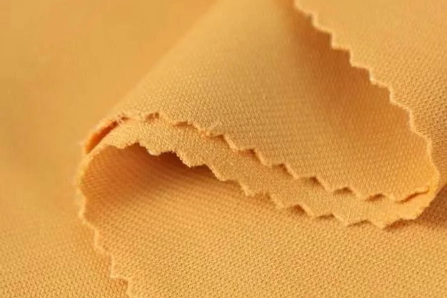 Polyester-Ammonias strikket stof